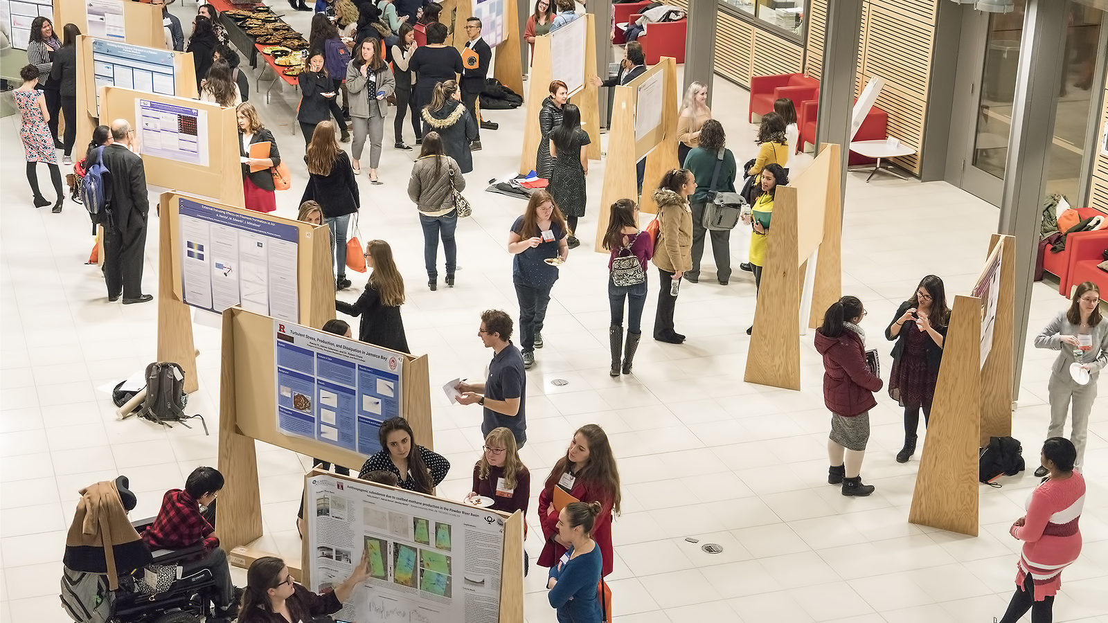 Photo of many CUWiP programs include a poster session where students have the opportunity to describe research